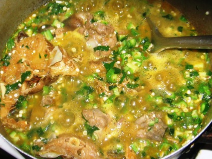 Okro soup . Boiling pot of okro soup.